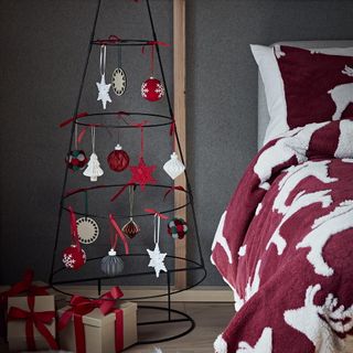 bedroom with bed and metal christmas tree