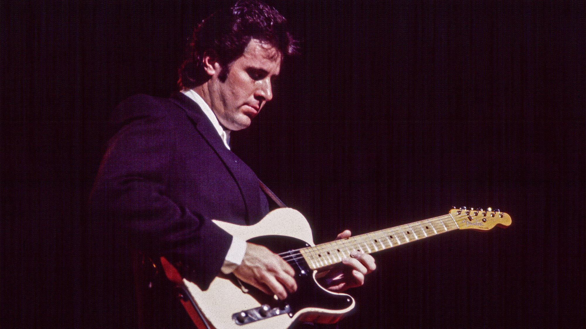Vince Gill plays electric guitar as he performs onstage at the Beacon Theatre, New York, New York, May 15, 1991.