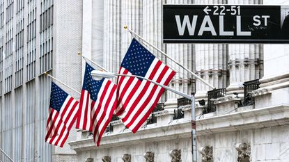 american flags flying on new york stock exchange building