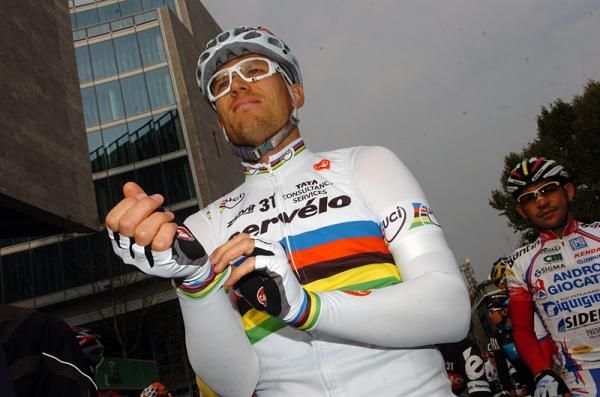 World champion Thor Hushovd resplendent in rainbow stripes at the start in Milan.