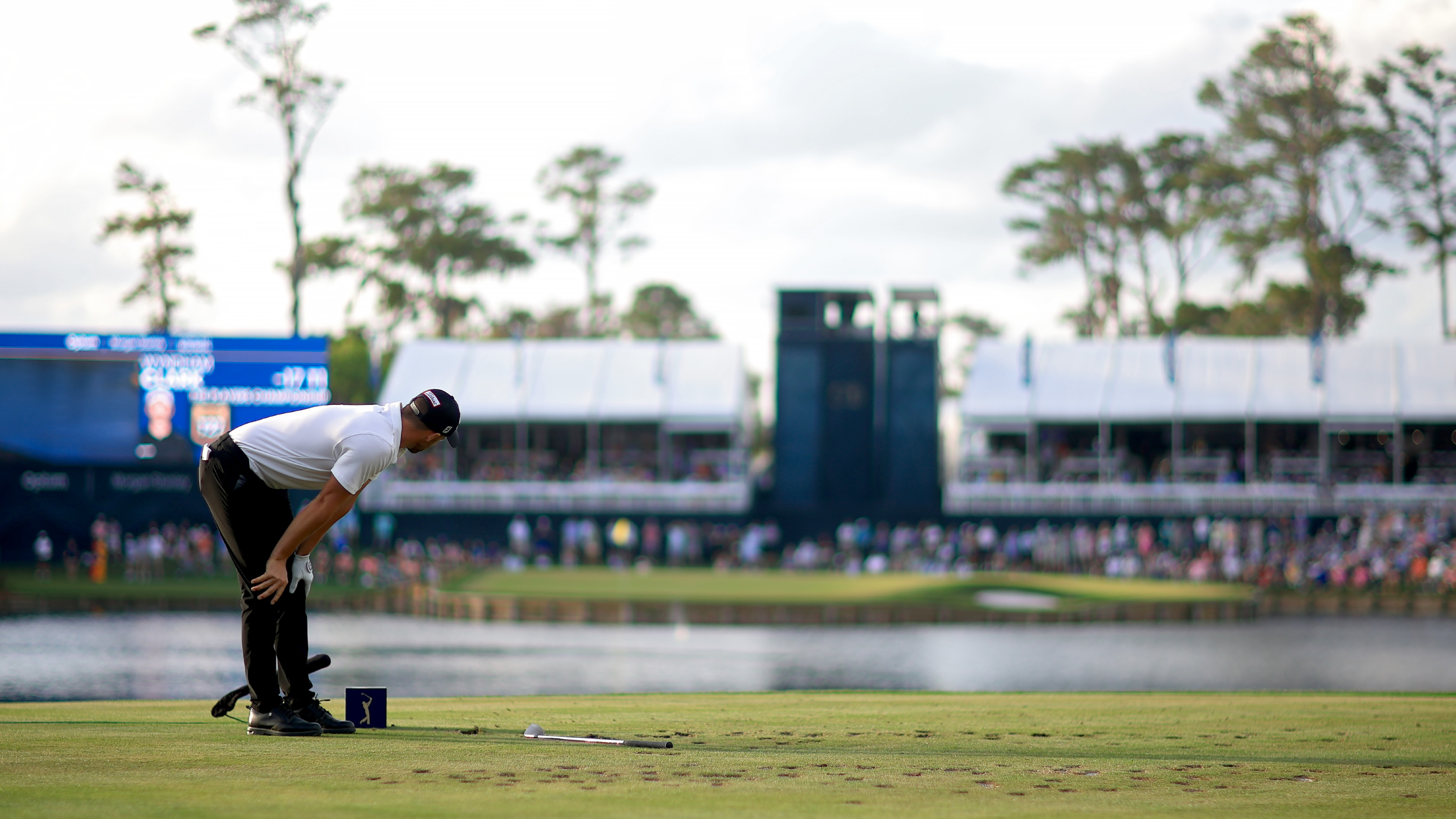Wyndham Clark watches his ball hit the water at the 17th at TPC Sawgrass in 2024