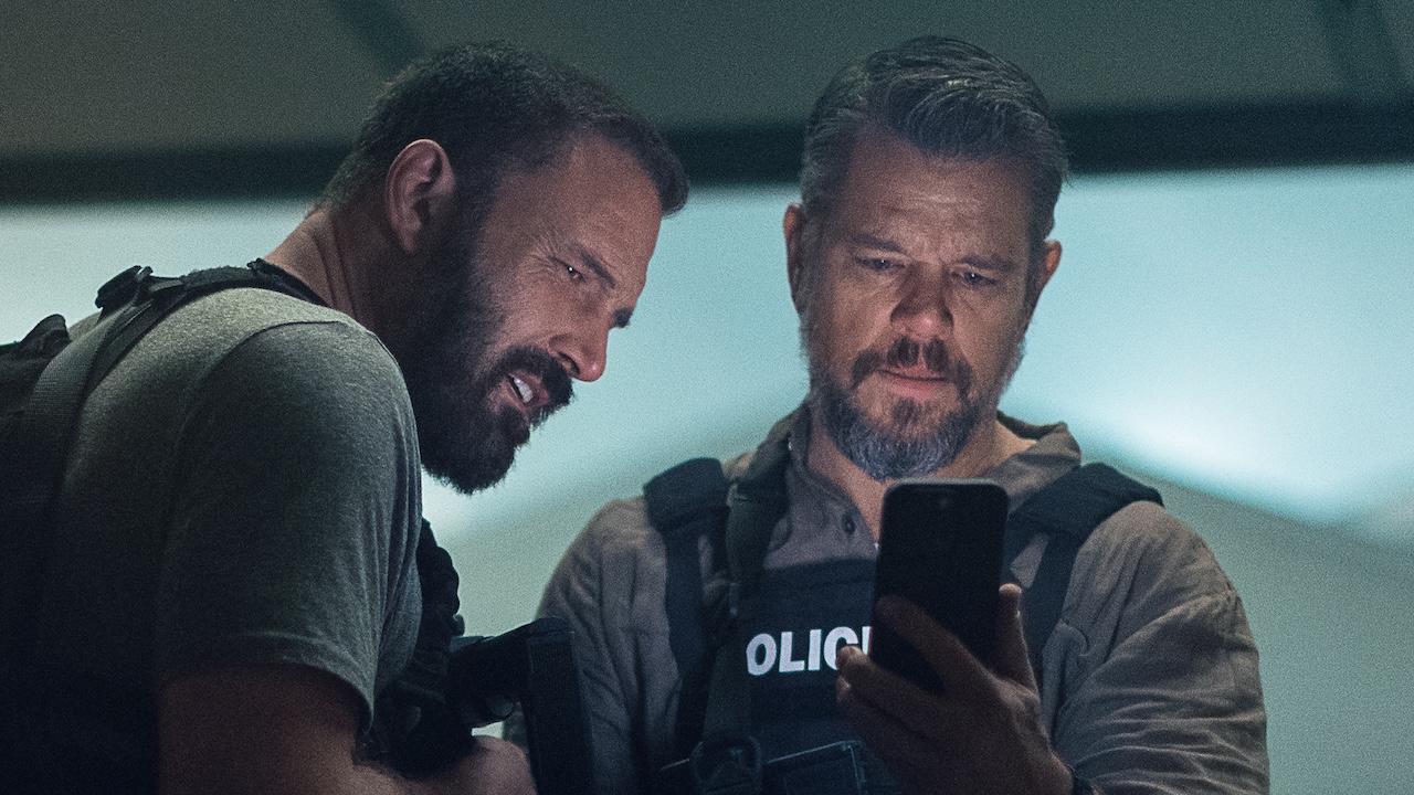 Dane and DJ looking at phone in The Rip