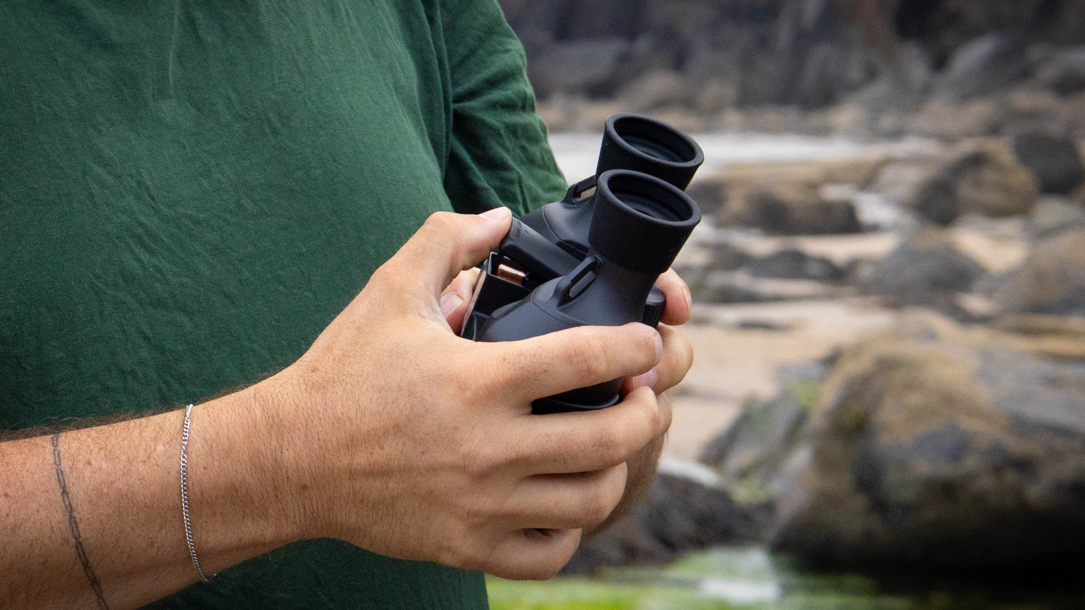 The battery compartment of the Canon 8x20 IS.