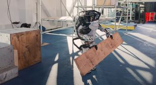 Boston Dynamics Atlas robot gripping board