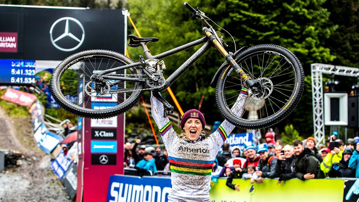 Rachel Atherton holds her downhill bike above her head after winning the 2019 Fort William downhill