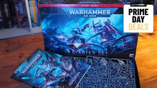 The Warhammer 40,000 Starter Set box and contents on a wooden table, with a 'Prime Day Deals' badge in the top corner