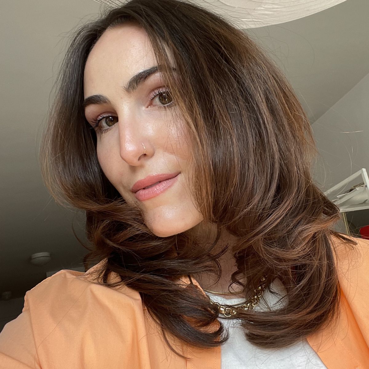 Image of Anna LaPlaca with long, bouncy curls.