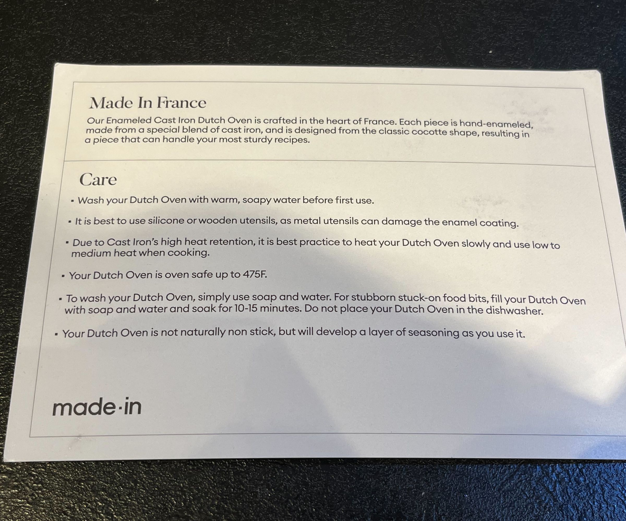 A piece of card with the written instructions on for caring for the Made In Dutch oven