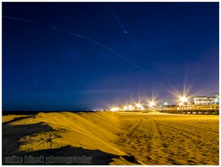 Mike Black snapped this 105-second exposure of a Minotaur 1 rocket streaking into space as seen from Spring Lake, N.J., on Nov. 19, 2013. The rocket launched 29 small satellites int">Mike Black Photography