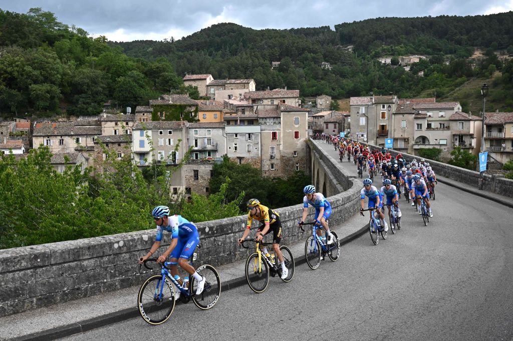 The pack rides during the first stage of the 74th edition of the Criterium du Dauphine cycling race 192 km between La VoultesurRhone and Beauchastel on June 5 2022 Photo by Marco BERTORELLO AFP Photo by MARCO BERTORELLOAFP via Getty Images