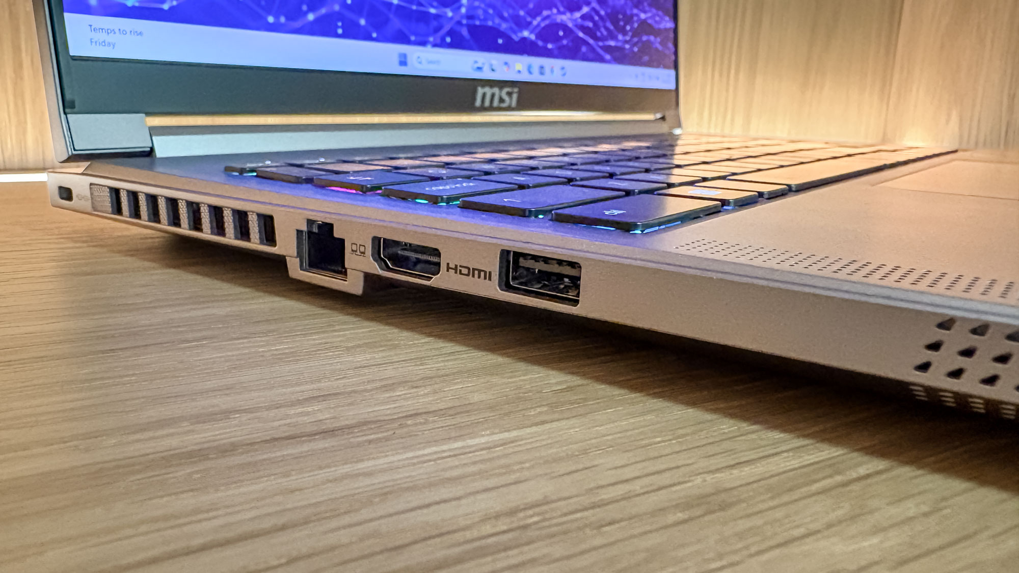 MSI Creator A16 AI+ on table showing side with ports