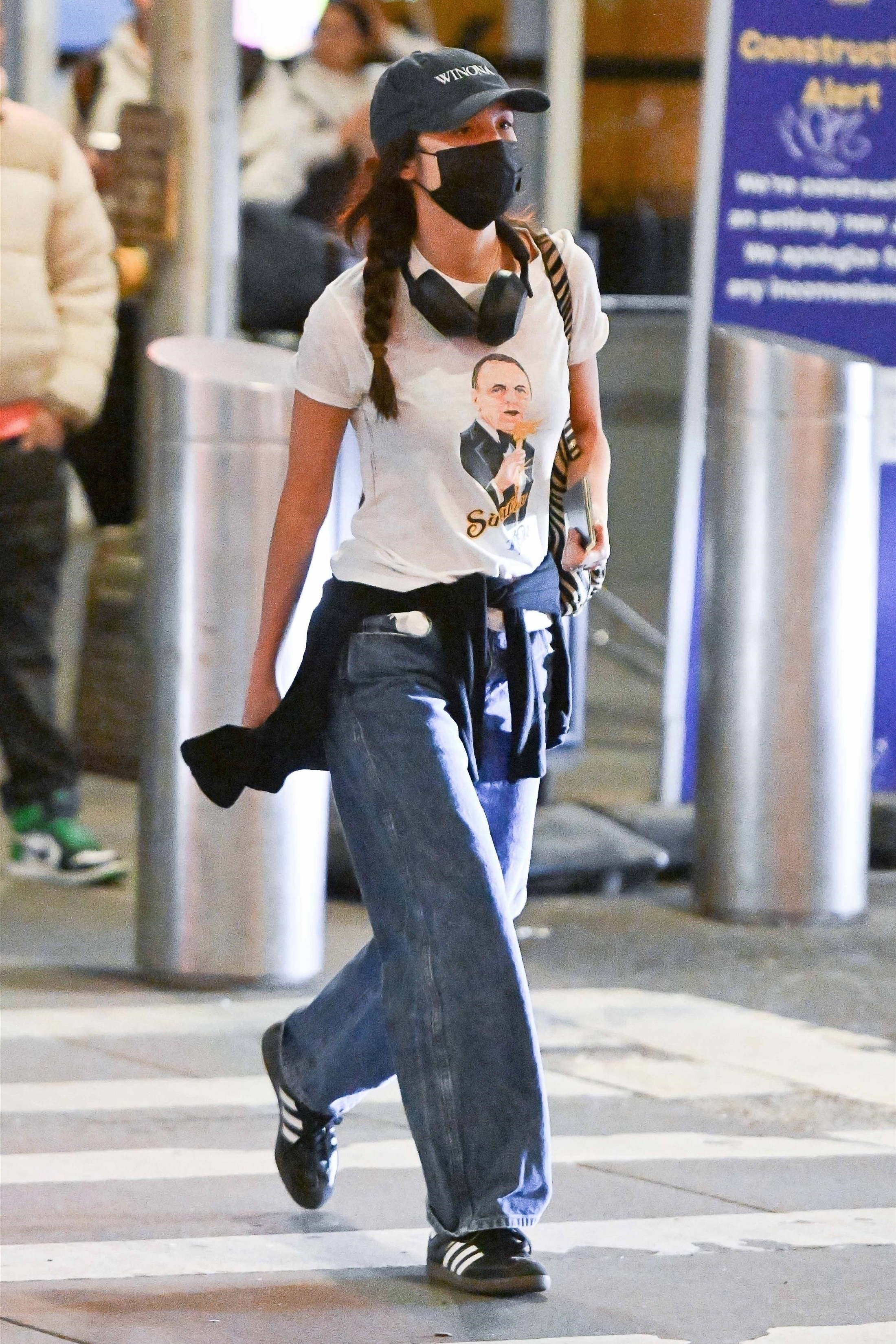 Olivia Rodrigo is spotted in the airport wearing Adidas Sambas sneakers.
