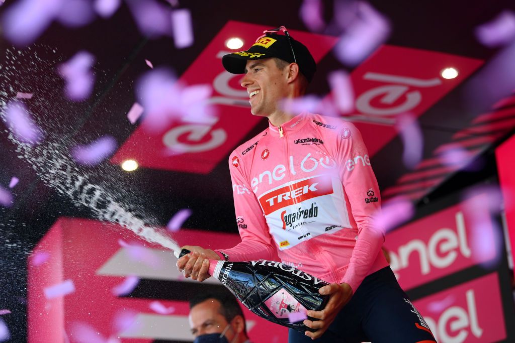 MESSINA ITALY MAY 11 Juan Pedro Lpez of Spain and Team Trek Segafredo celebrates winning the pink leader jersey on the podium ceremony after the 105th Giro dItalia 2022 Stage 5 a 174km stage from Catania to Messina Giro WorldTour on May 11 2022 in Messina Italy Photo by Tim de WaeleGetty Images