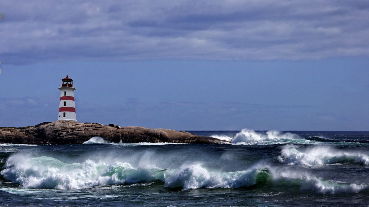 A lighthouse signals a safe harbor for passing ships.