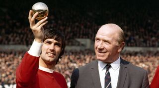 Manchester United footballer George Best shows manager Sir Matt Busby his European Footballer of the Year Award at Old Trafford, 1969. (Photo by Albert Cooper/Mirror Syndication International/Mirrorpix via Getty Images)