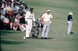 Arnold Palmer and his caddie at the 1965 Masters