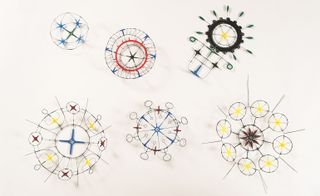 Circular, colourful art piece designs on a white background