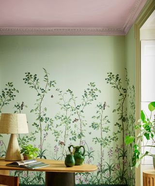 green wallpapered room with accent pink ceiling