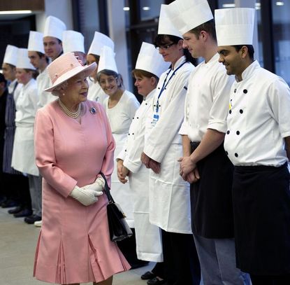 The Queen honors the head chef with a toast. 