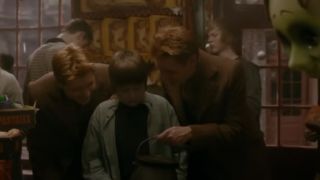 Fred and George showing their candies to someone in Harry Potter and the Half Blood Prince.