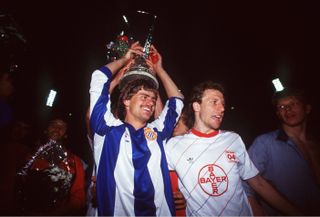 Bayer Leverkusen's Wolfgang Rolff, wearing an Espanyol shirt, celebrates after the German team's UEFA Cup final win over the Spanish side on penalties in May 1988.