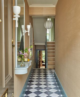 beige hallway with black and white checkerboard floor tiles