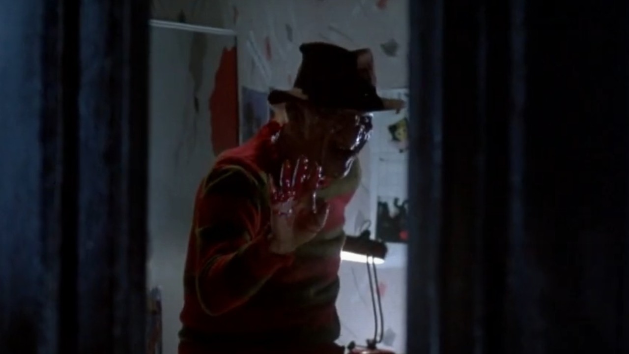 Robert Englund waving hello in A Nightmare on Elm Street 2: Freddy's Revenge