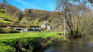 Stone cottage in Cornwall with gardens.