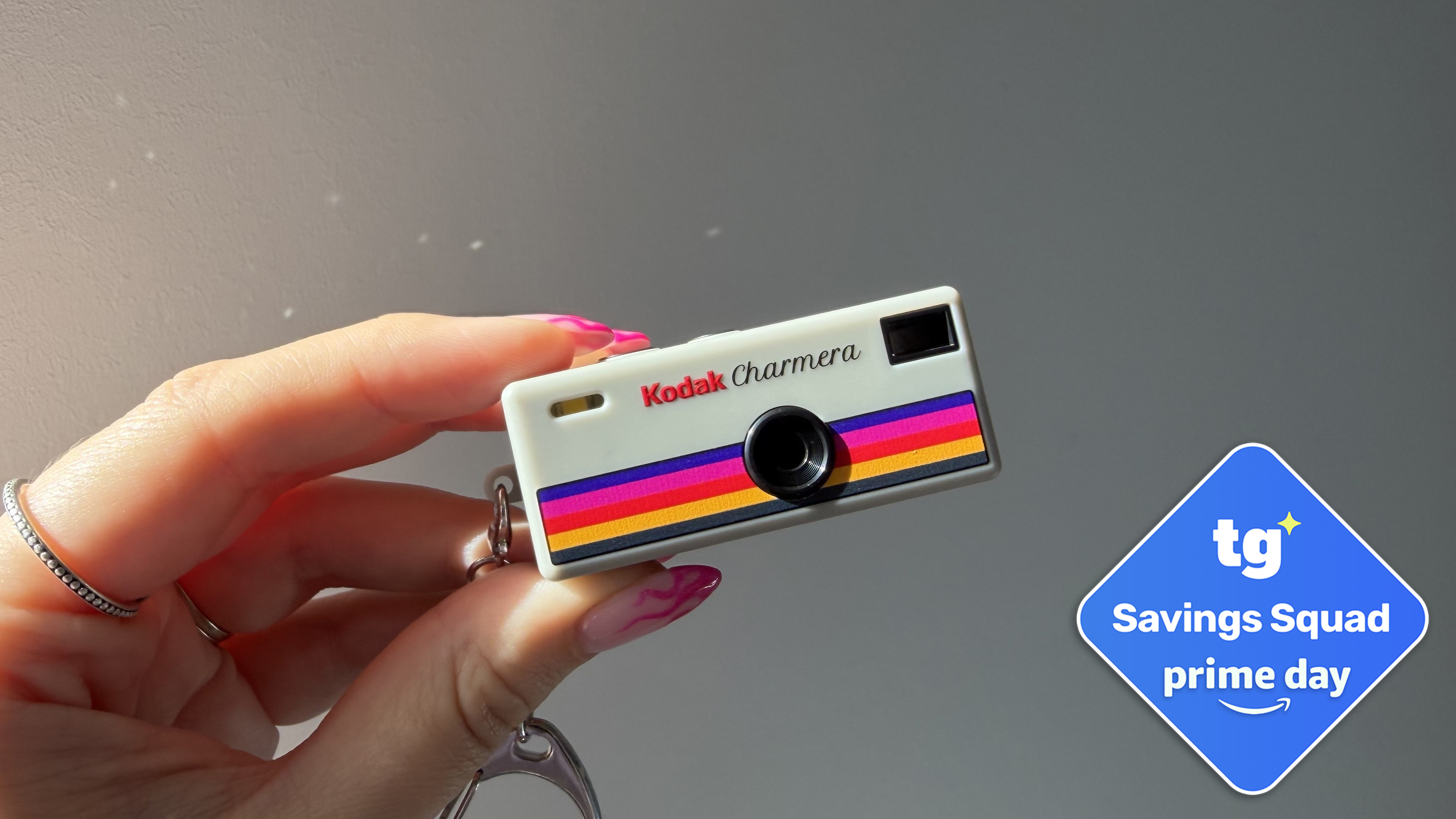 Hand holding kodak charmera with tom's guide deal badge
