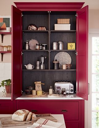 Red kitchen with pantry cupboard