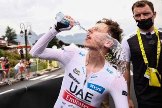UAE Team Emirates' Slovenian rider Tadej Pogacar wearing the best young rider's white jersey reacts in the finish area after the 16th stage of the 110th edition of the Tour de France cycling race, 22 km individual time trial between Passy and Combloux, in the French Alps, on July 18, 2023. (Photo by Anne-Christine POUJOULAT / POOL / AFP)