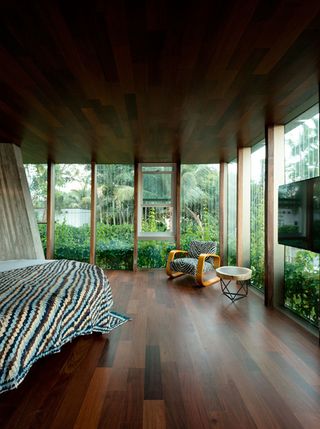 The rest of the structure includes a glazed central floor containing a master bedroom...