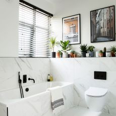 White bathroom with venetian blinds