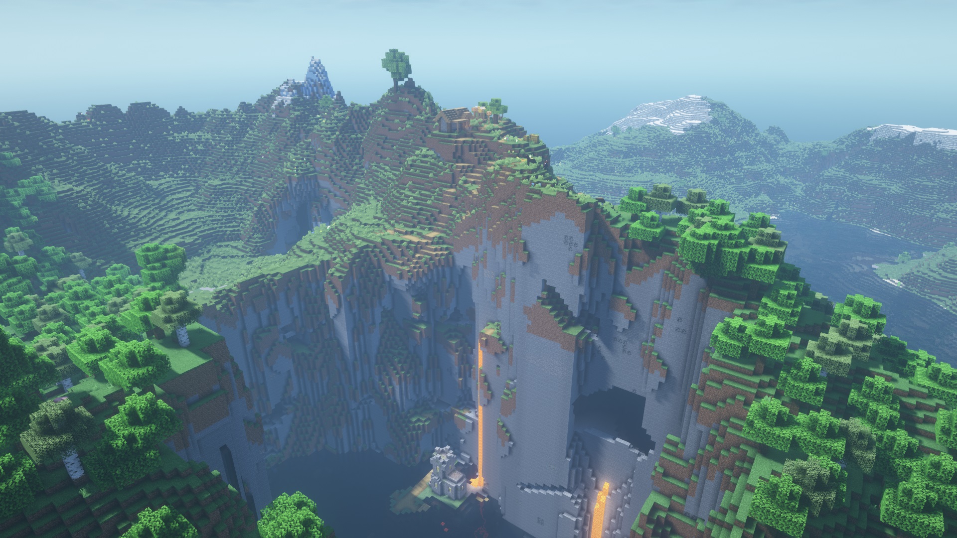 Minecraft seed - A sheer stone ridge with a house at the top and a church in a ravine below.