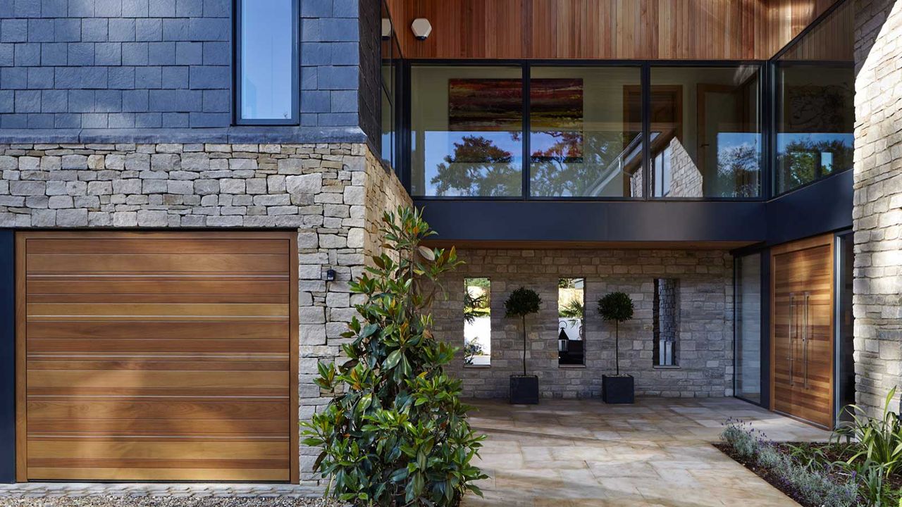 house exterior with wooden garage door