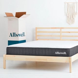 Beat cheap mattress on bed with box beside 