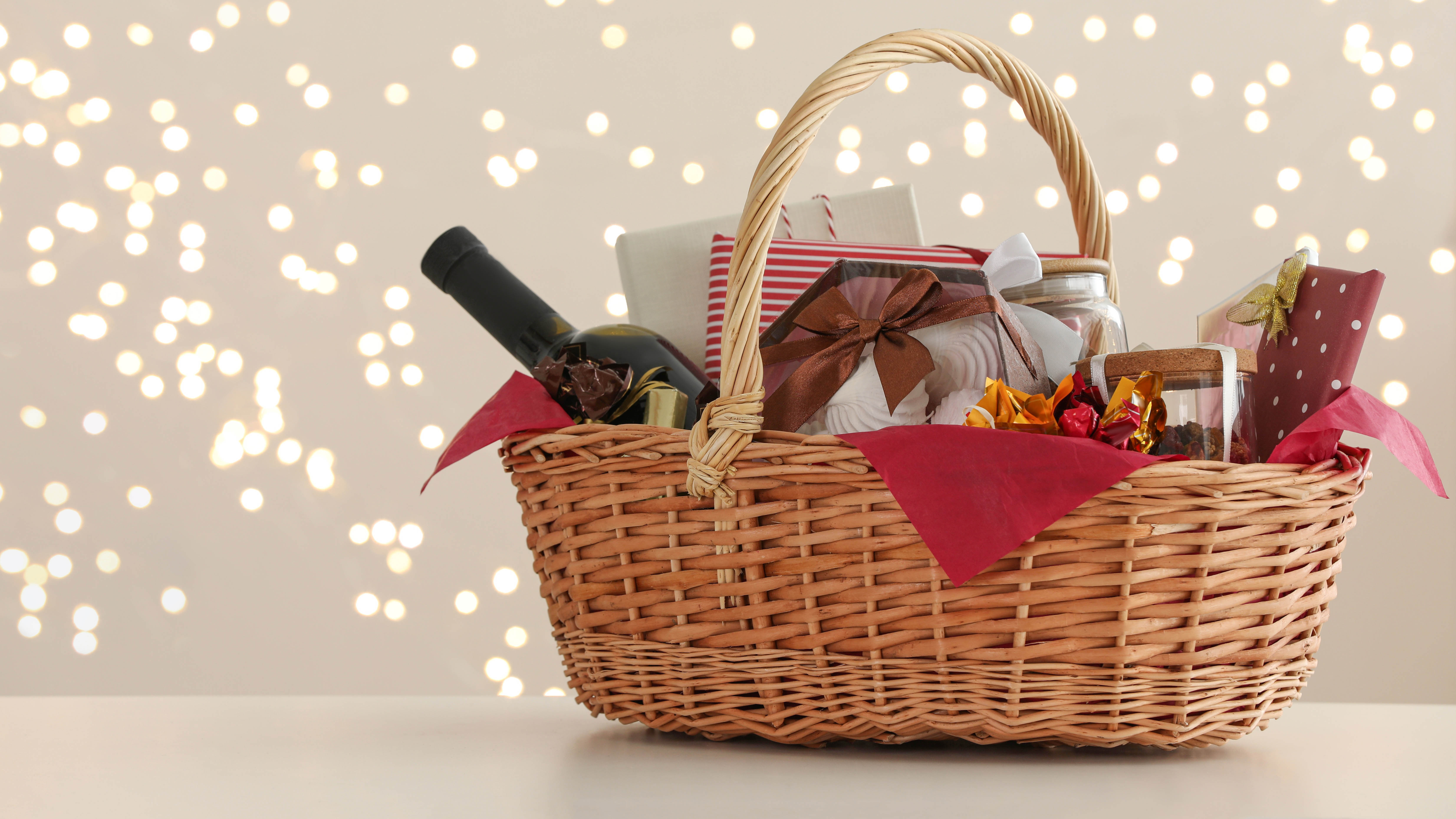 Wicker basket full of Christmas gifts