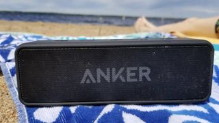 Anker Soundcore 2 on a beach towel kicking out killer tunes