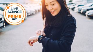 A Live Science Prime Day logo and a woman checking her smartwatch