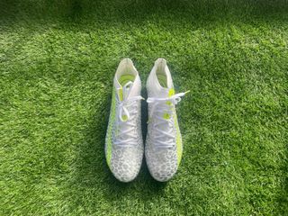 Kipsta CLR Elite football boots made by Decathlon. Placed onto astroturf for a clear look at them.