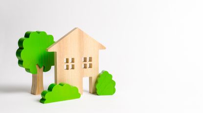 Wooden toy house and trees