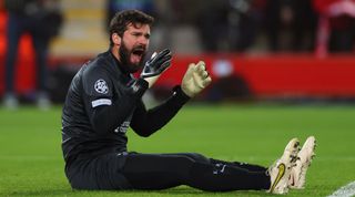 Alisson of Liverpool looks aghast after making a mistake during the UEFA Champions League round of 16 first leg match between Liverpool and Real Madrid at Anfield on 21 January, 2023 in Liverpool, United Kingdom.