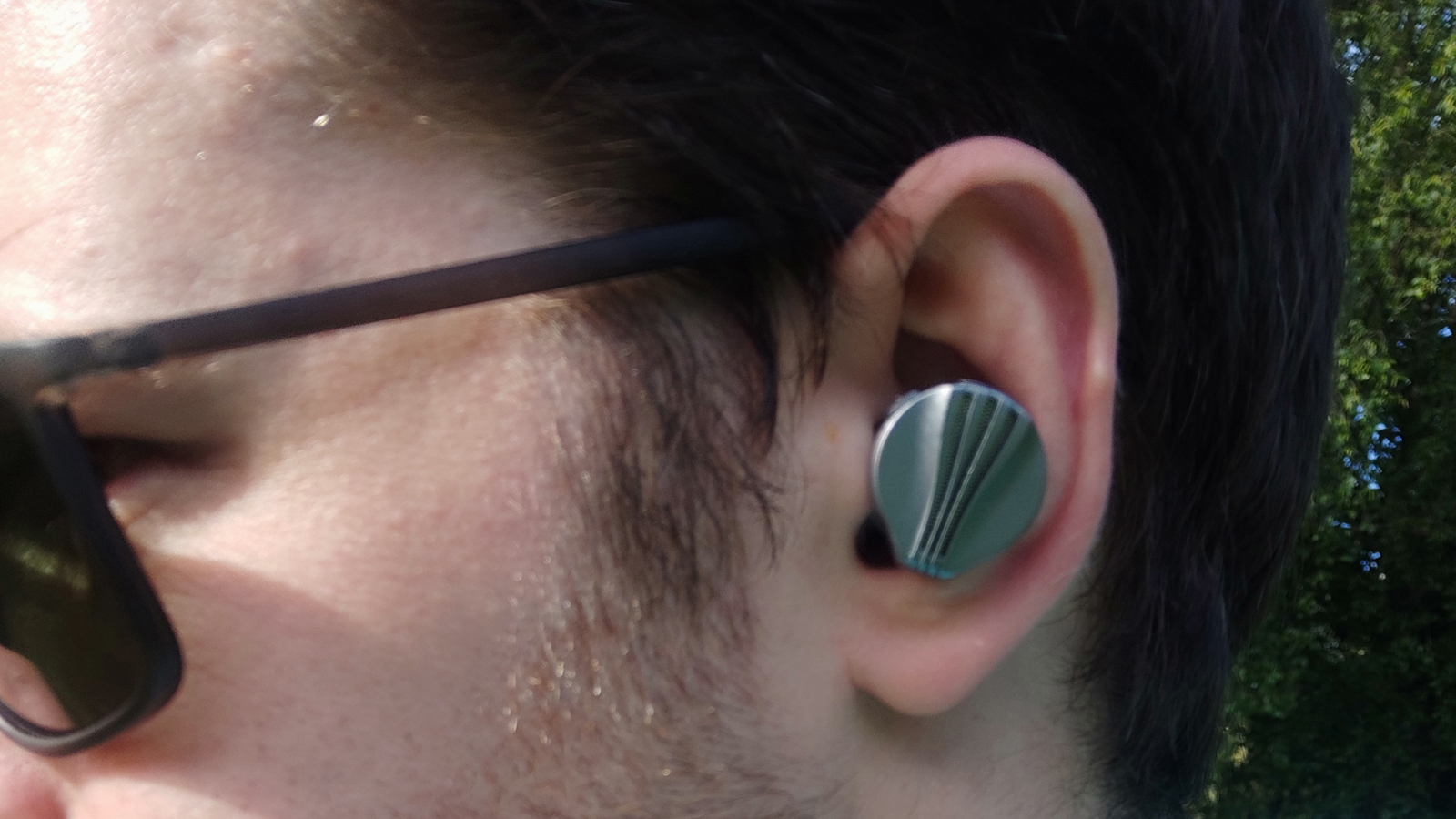 The FiiO FW3 in a man's ears.