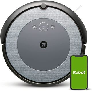 The iRobot Roomba i3 with a smartphone on a white background