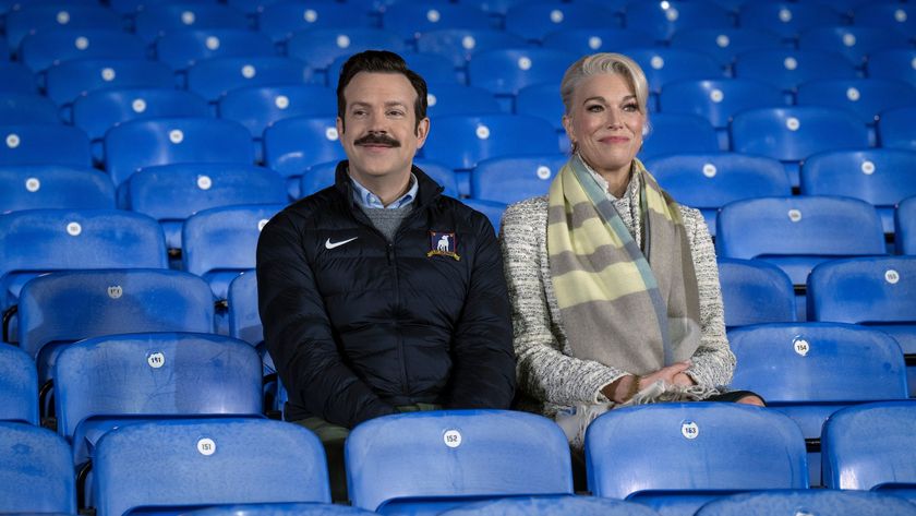 Ted Lasso and Rebecca Walton sit in the stands in Ted Lasso