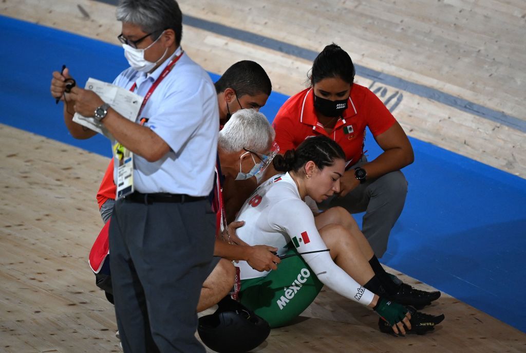 Mexicos Luz Daniela Gaxiola Gonzalez is assisted after crashing during a heat of the womens track cycling keirin semifinals during the Tokyo 2020 Olympic Games at Izu Velodrome in Izu Japan on August 5 2021 Photo by Greg Baker AFP Photo by GREG BAKERAFP via Getty Images