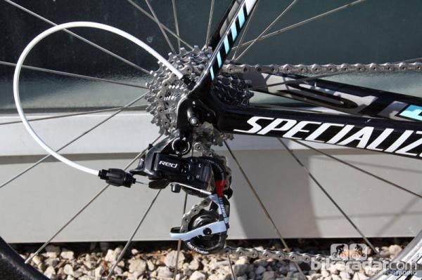 The rear derailleur cable is internally routed on the Specialized S-Works Tarmac SL4. This older SRAM Red rear derailleur has been since replaced by the newer version, too.