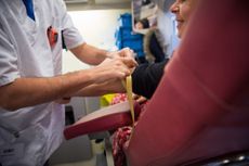 A nurse preparing a donor.