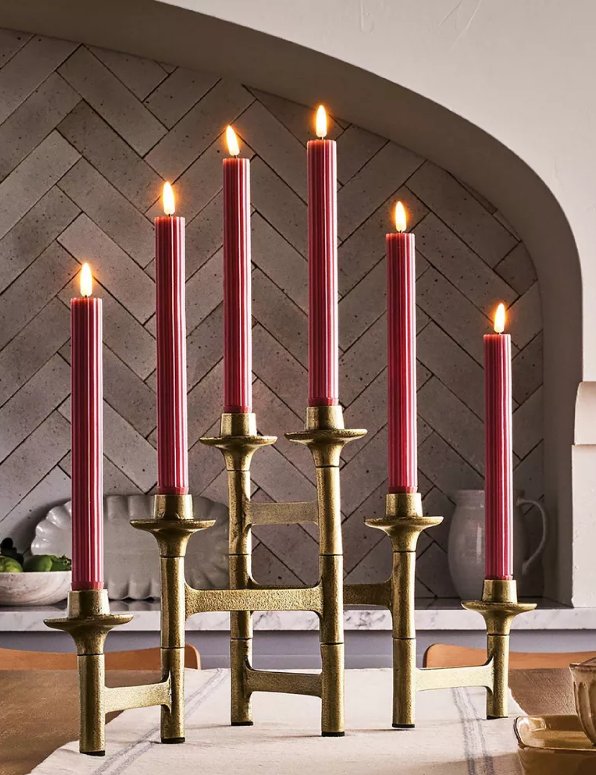 Six-taper candelabra in brass styled in a characterful kitchen