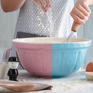 women with flour and blue pink bowl